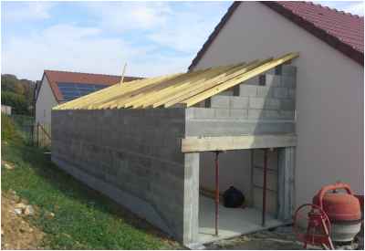 Construction d'un garage avec toiture à une pente accolé à un pavillon