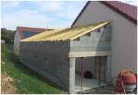 Construction d'un garage avec toiture à une pente accolé à un pavillon